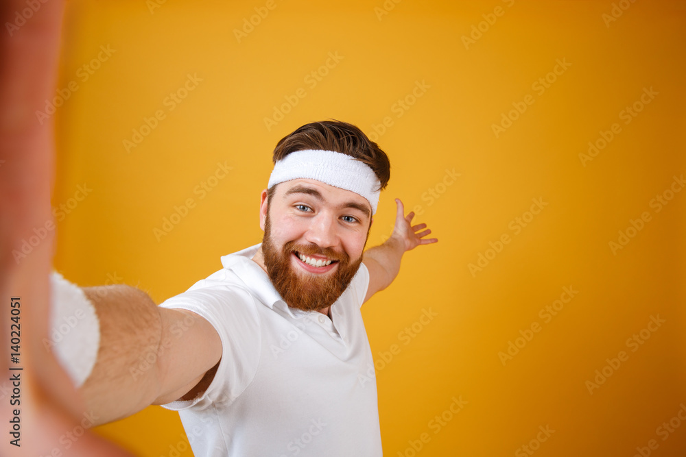 Smiling sportsman making selfie Smiling sportsman making selfie