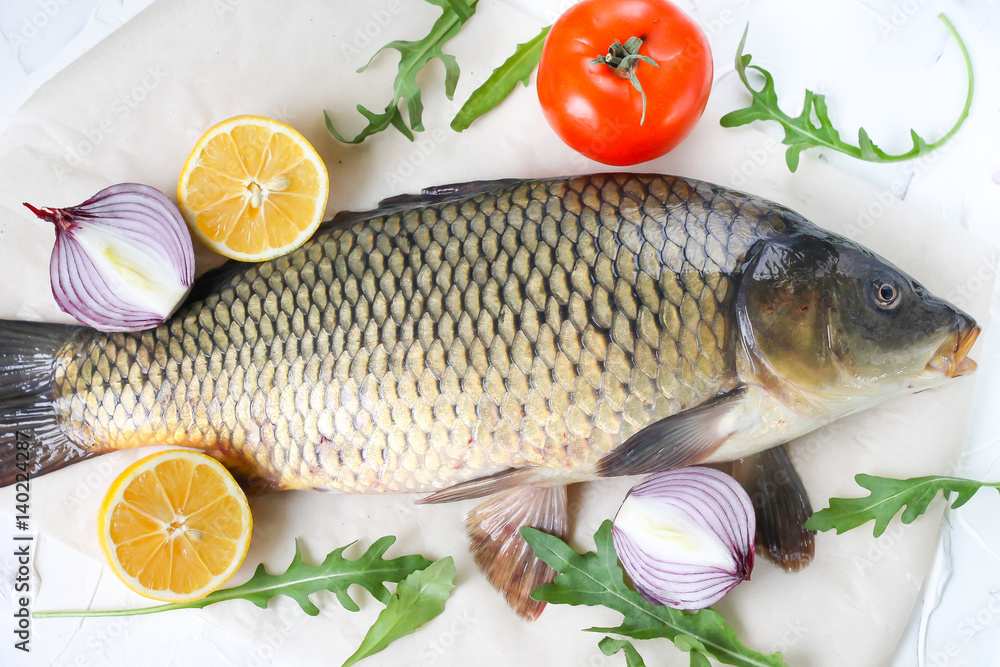  carp with lemon and tomato - fresh river fish