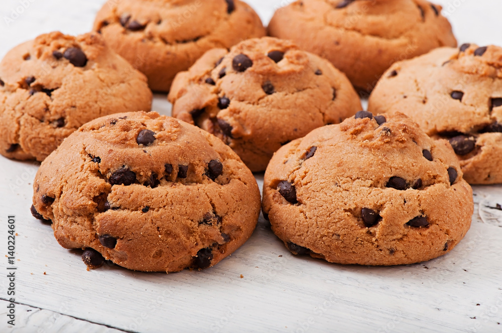 Chocolate chip cookies on the old wooden background, food. Chocolate chip cookies on the old wooden background, food.
