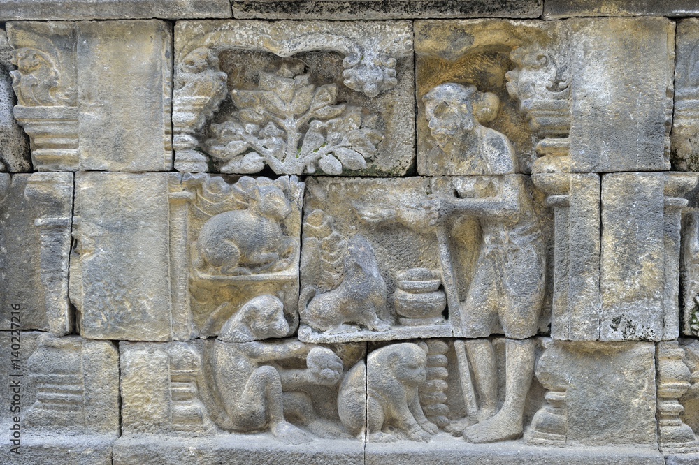 Detail of Buddhist carved relief in Borobudur temple in Yogyakarta, Java, Indonesia..