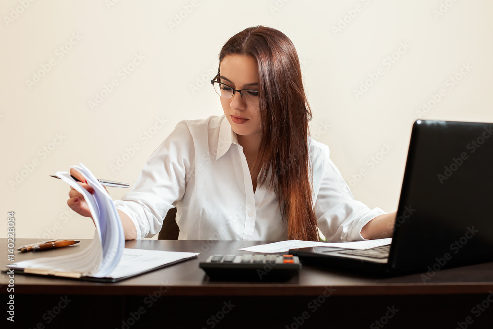 Young woman accountant at workplace concept