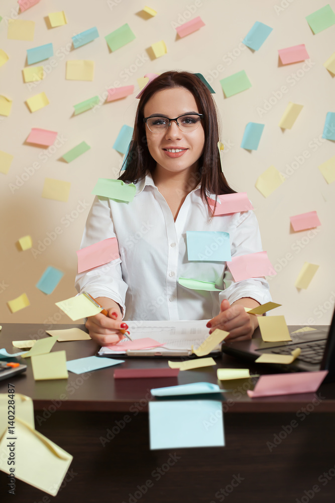 Female accountant in glasses sitting at workplace Female accountant in glasses sitting at workplace