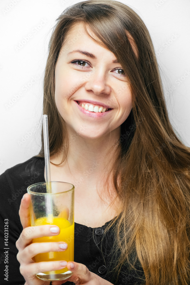 Young woman close up portrait drink orange juice. Female model happy smile. Young woman close up portrait drink orange juice. Female model happy smile.