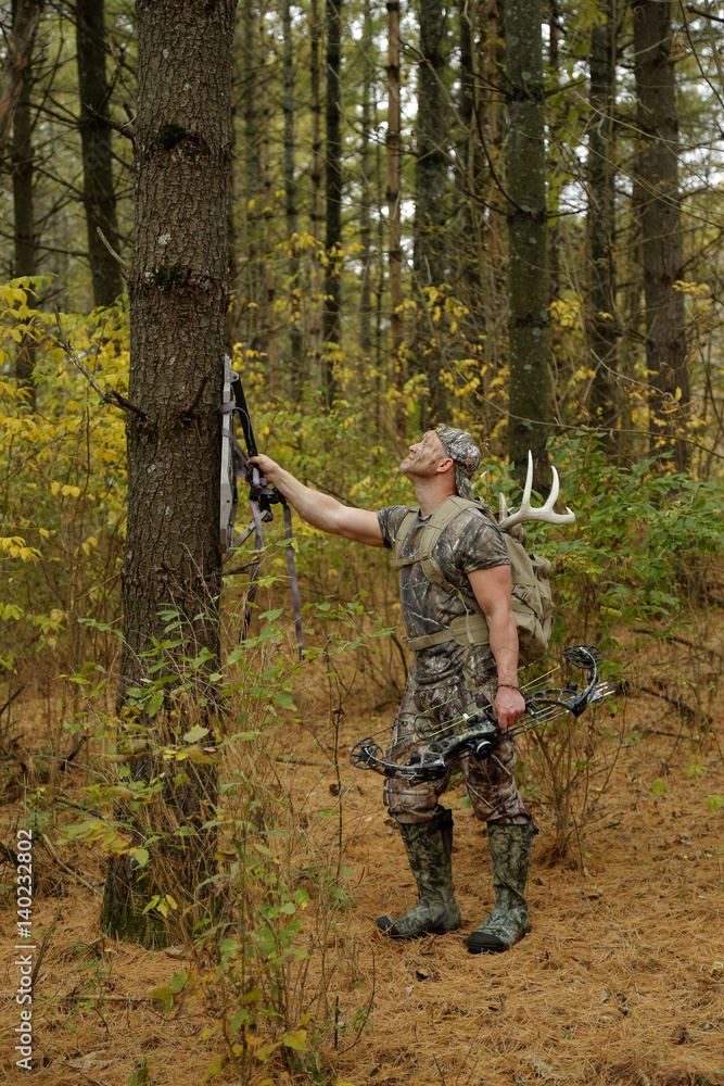 Bow hunter tracking prey