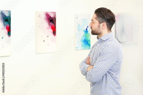 Young man in modern art gal...