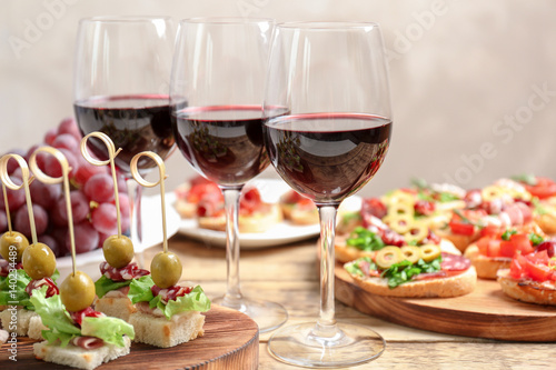 Wine with tasty bruschetta served on table