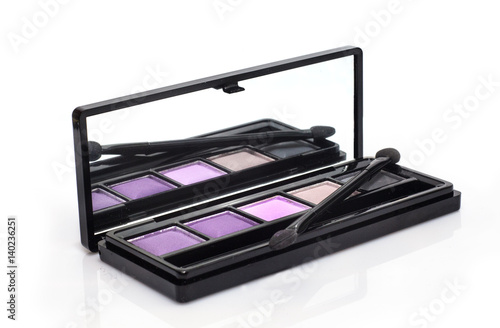 Close-up of make-up eye shadow palette with shadow brush photo