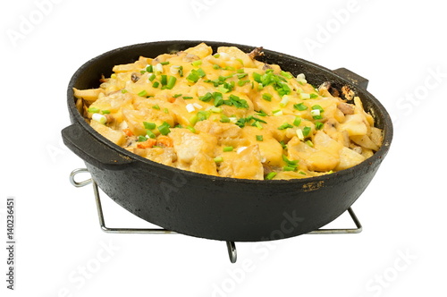 potatoes cooked in a frying pan with cheese, on a white background