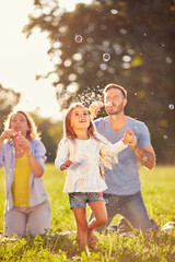 Fun for female child with soap bubbles  .