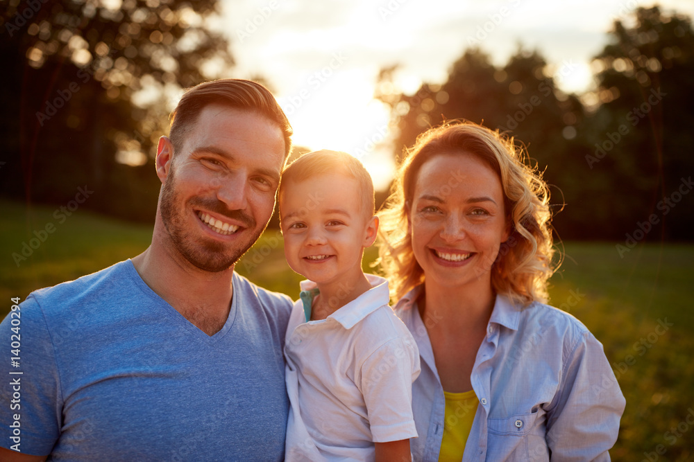 Smiling family together, portrait