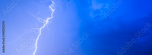Thunderstorms thunder lightning night sky clouds overcast summer rain, background panorama and with space for text