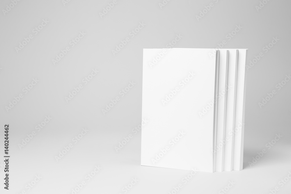 Real paperback white books on a gray background Real paperback white books on a gray background