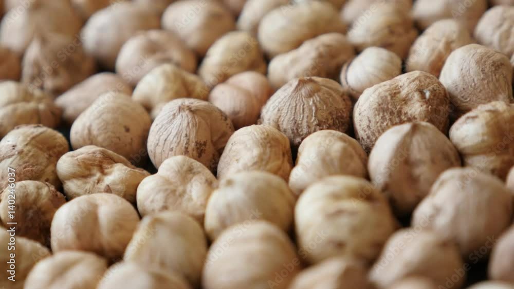 Slow pan on Corylus avellana cob fruit on table 4K 2160p 30fps UltraHD footage - Food background of raw common hazelnuts close-up 3840X2160 UHD panning video Slow pan on Corylus avellana cob fruit on table 4K 2160p 30fps UltraHD footage - Food background of raw common hazelnuts close-up 3840X2160 UHD panning video