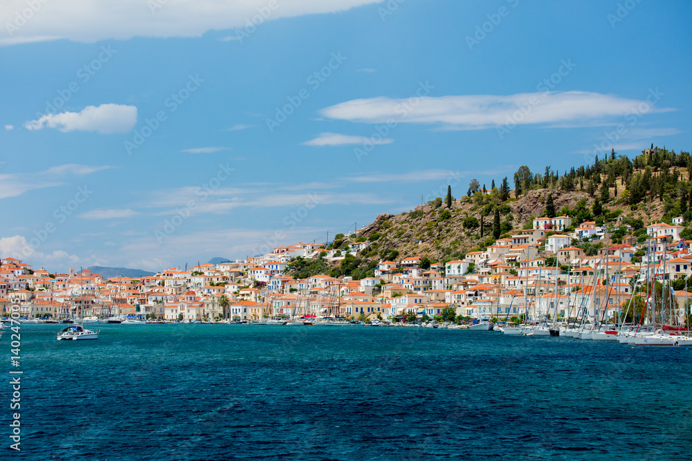 POROS, GREECE - JUNE 08, 2016: a beautiful view of the wonderful port city on the sky background in Greece