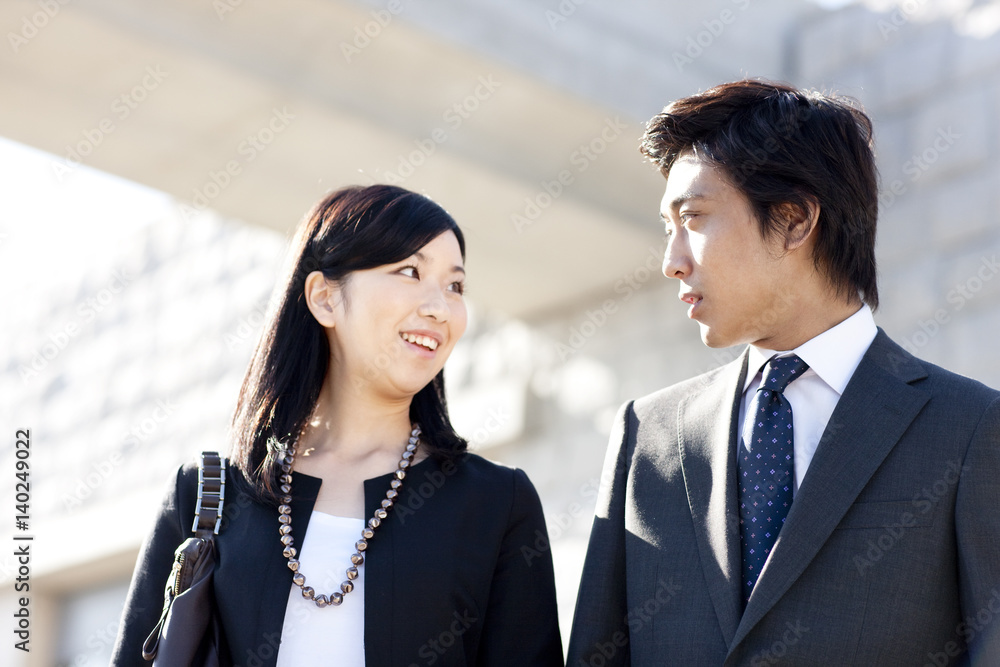 Young businessman and businesswoman talking Young businessman and businesswoman talking