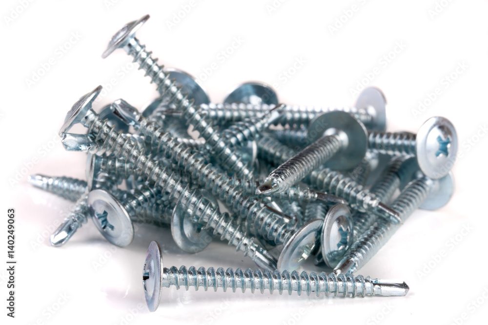 pile of metal screws isolated on white background pile of metal screws isolated on white background