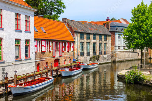Historic medieval buildings with beautiful canal in the old town of Bruges (Brugge), Belgium
