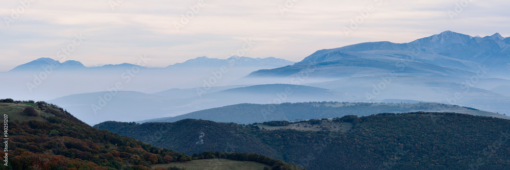 Mountains in the fog of Mount San Vicino, Italy