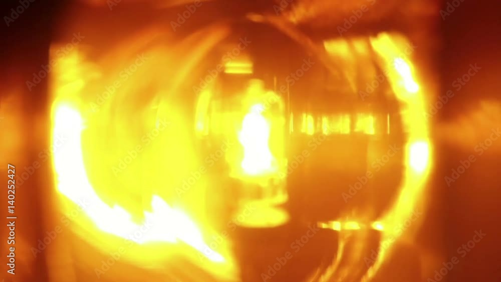 Extreme close-up of orange flasher light, warning hazard sign Extreme close-up of orange flasher light, warning hazard sign