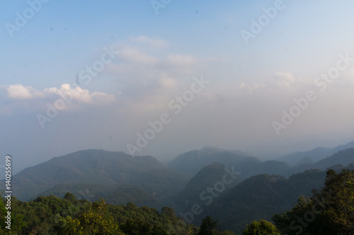 Mountain background while sunset with fog