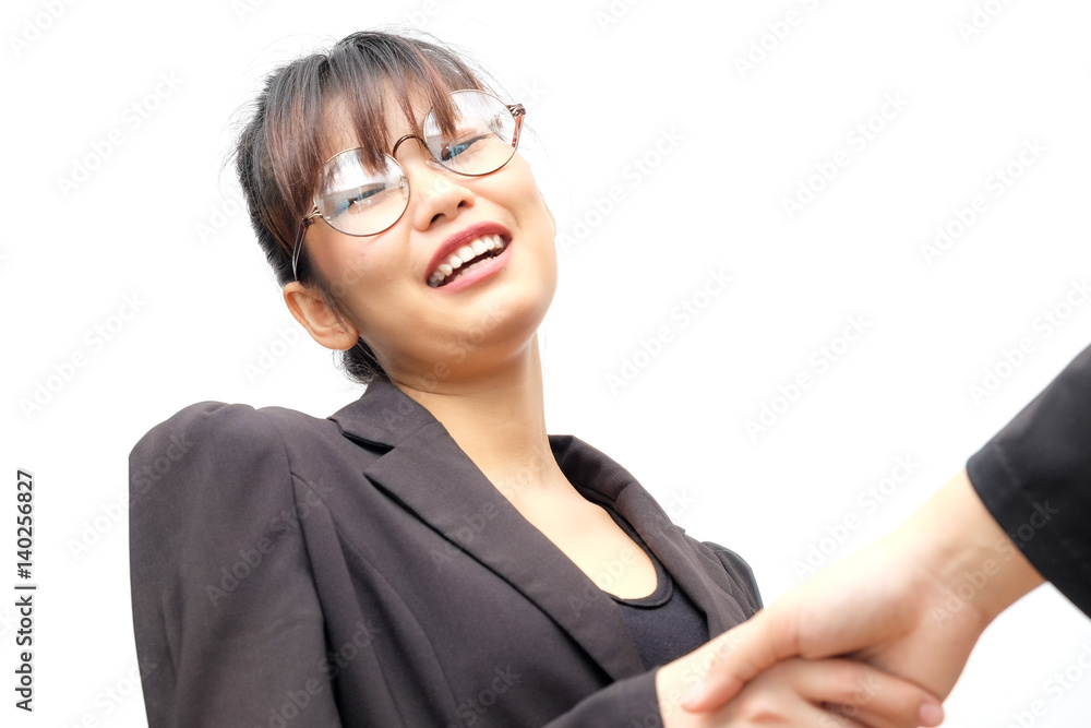 Asian business women shake hand with partner job success Asian business women shake hand with partner job success