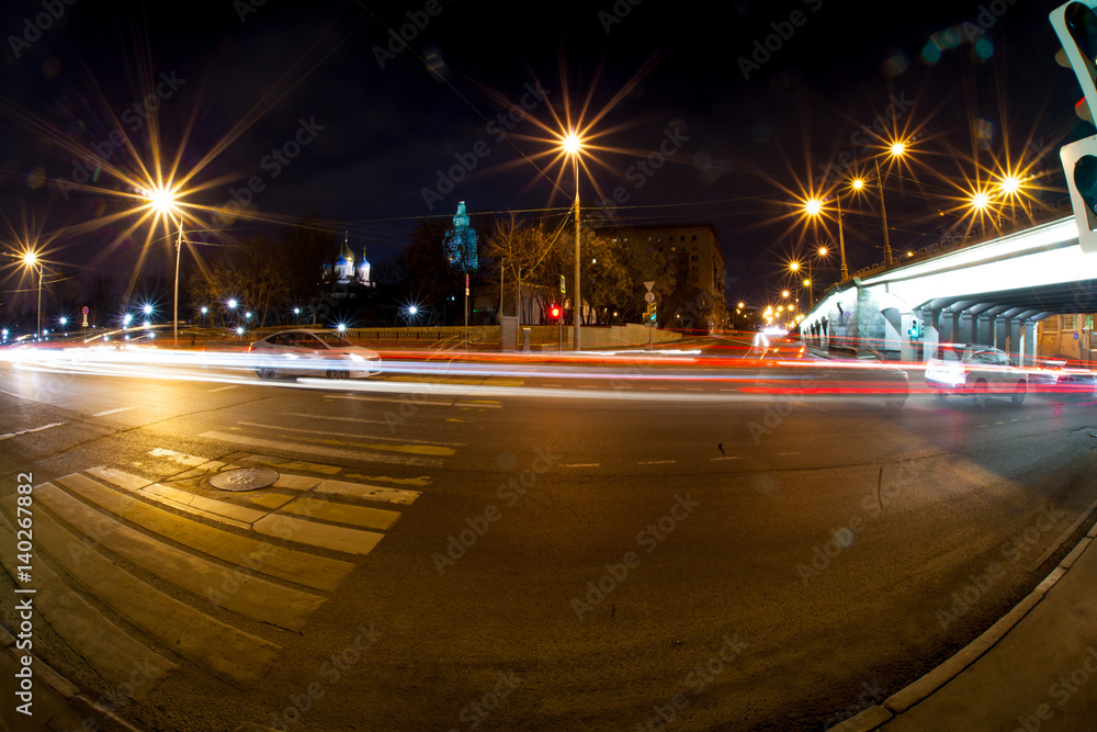 Urban city road with car light trails at night   