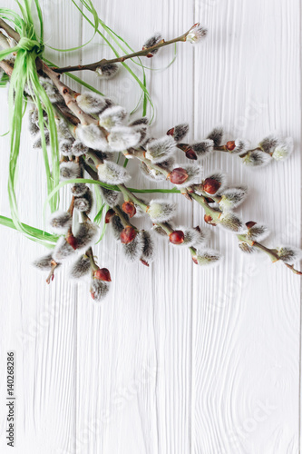 Easter concept branches twigs and eggs on a wooden background