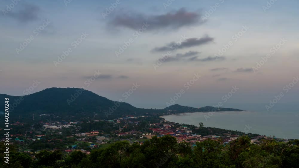 Spectacular sunset over town, valley and sea lagoon from the top of mountain Spectacular sunset over town, valley and sea lagoon from the top of mountain