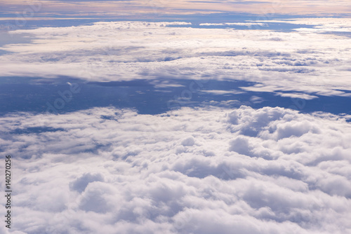 Blue sky and Clouds as seen through window of aircraft © CasanoWa Stutio