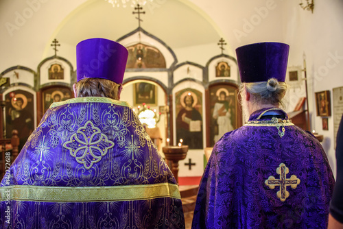 Wall Mural Backs of two priests celebrating the Feast of Orthodoxy on the first Sunday of G