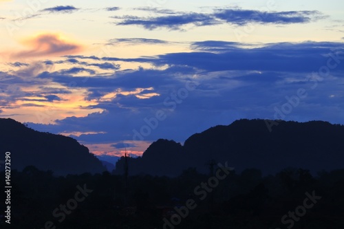 sky in sunset and raincloud  colorful twilight time in city  with mountain silhouette  art beautiful in nature