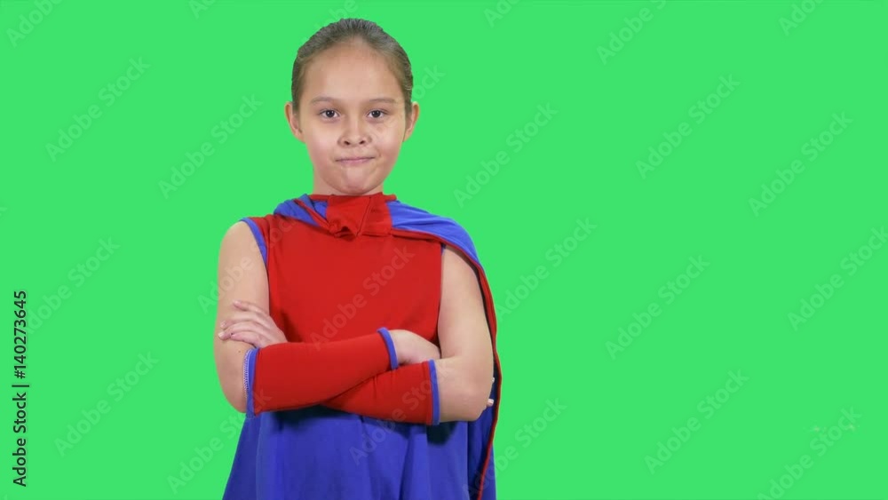 Superhero girl standing folds arms Superhero girl standing folds arms
