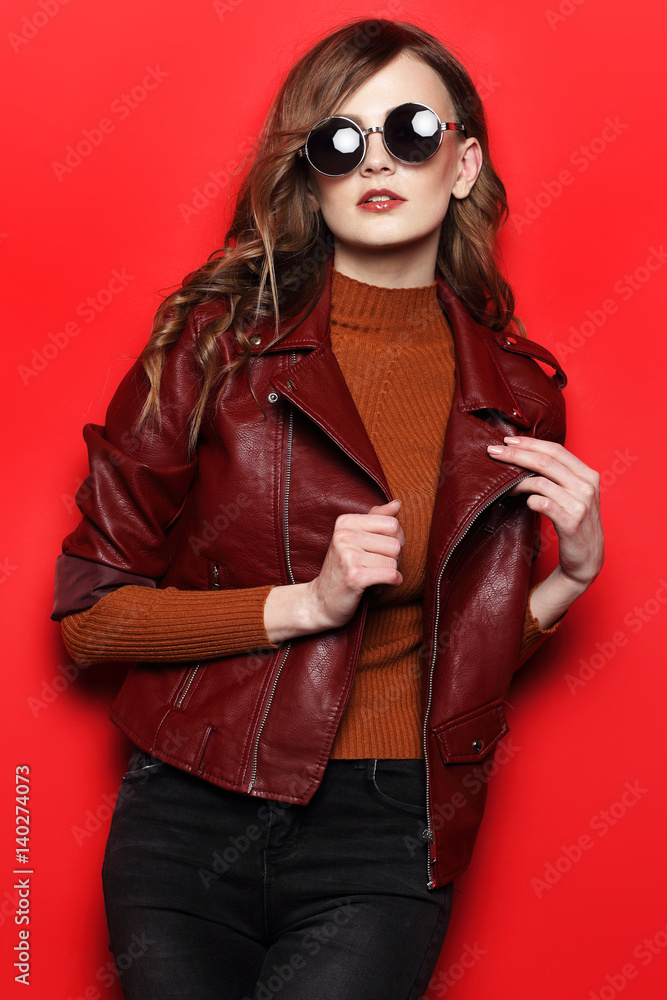 fashion model in sunglasses, beautiful young woman. leather jacket, studio shot fashion model in sunglasses, beautiful young woman. leather jacket, studio shot