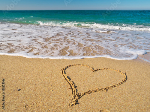 Heart on the sand of a beach.