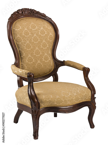 Gold and dark wood upholstered arm chair front view with clipping path.