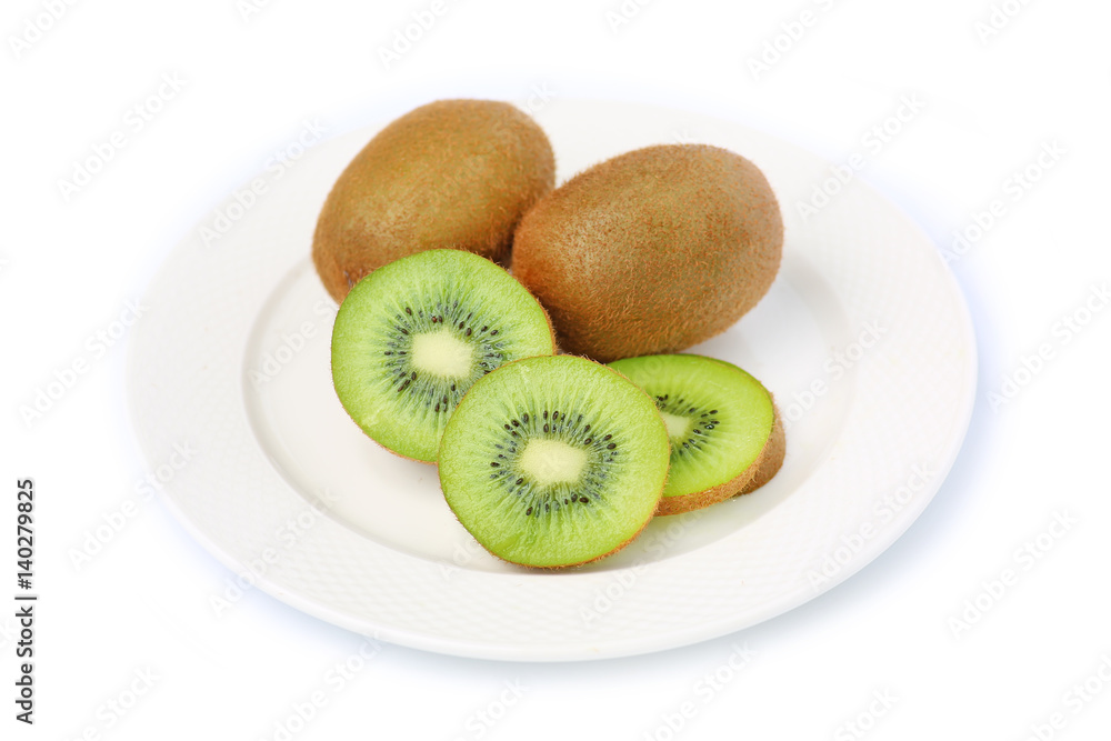 Kiwi fruit in white plate on white background Kiwi fruit in white plate on white background