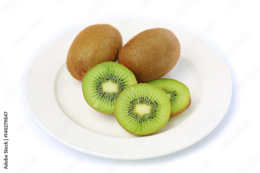 Kiwi fruit in white plate on white background Kiwi fruit in white plate on white background