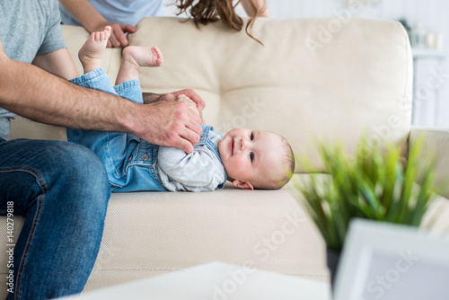  family with the baby on the sofa photo