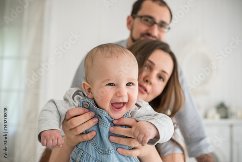  family with the baby on the sofa