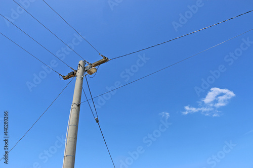 power pole and power lines in a blue sky