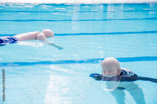 dummy drowning training child and adult float in the pool