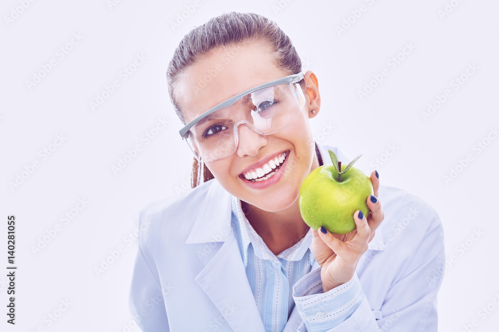 Smiling woman doctor with a green apple Smiling woman doctor with a green apple