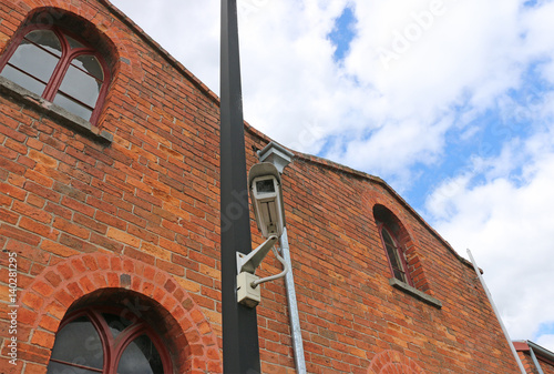 CCTV camera installed on a red brick building