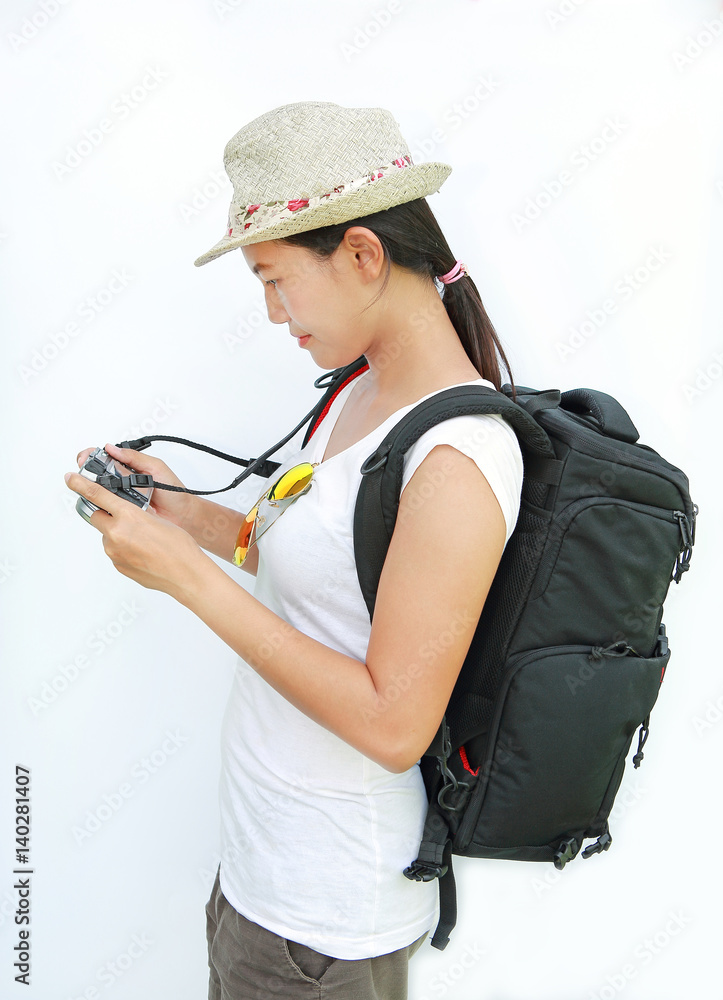 Portrait of young girl traveler with camera isolated on white background
Portrait of young girl traveler with camera isolated on white background