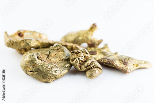 Gold nuggets on white background. 
