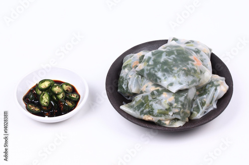 Steamed Dumpling stuffed with garlic chives with spicy soy source.