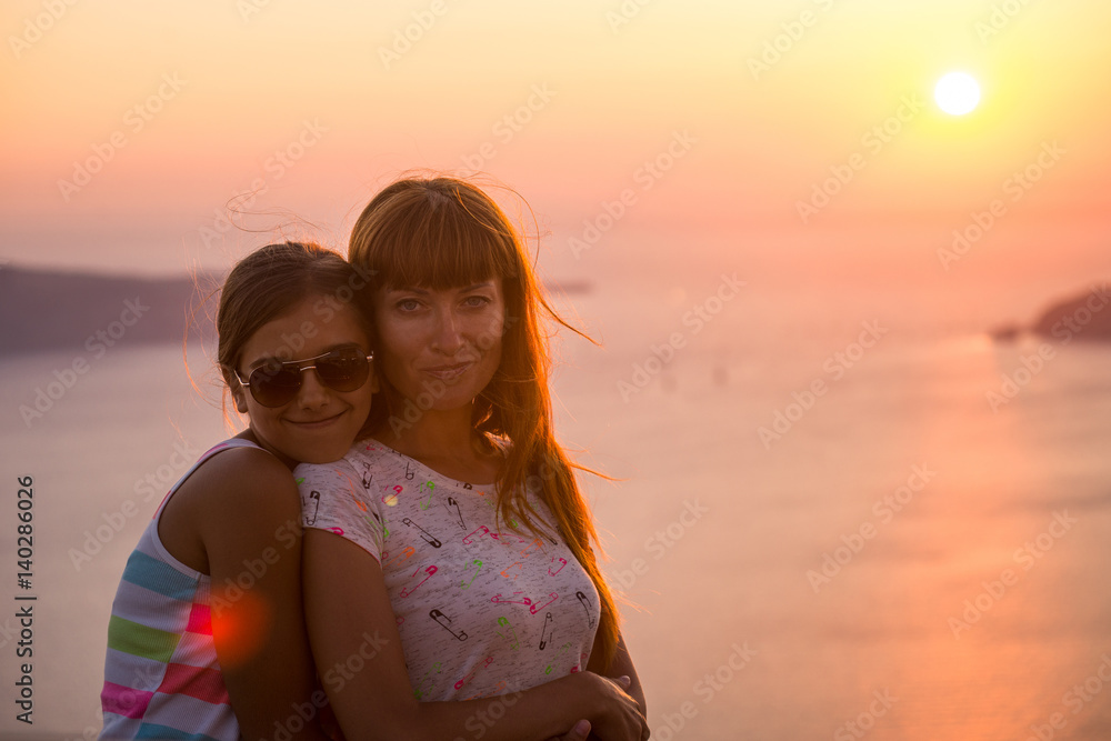 Mother and daughter at sunset. Mother and daughter at sunset.