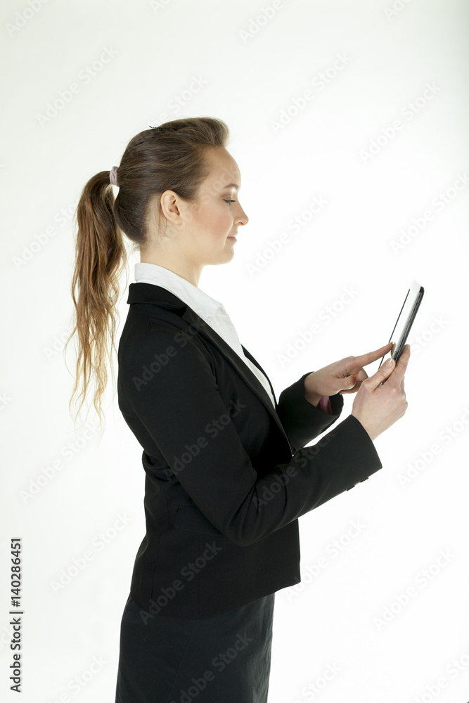 Young business woman with tablet computer stand sideways
Young business woman with tablet computer stand sideways