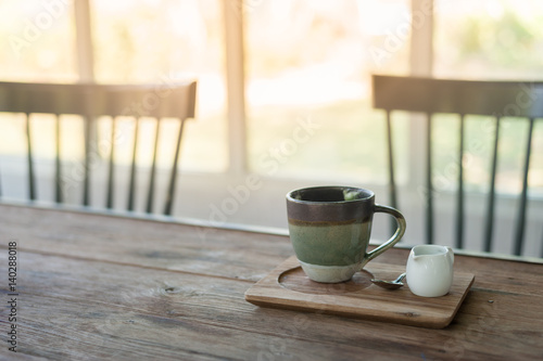 Ceramic coffee cup on wood table