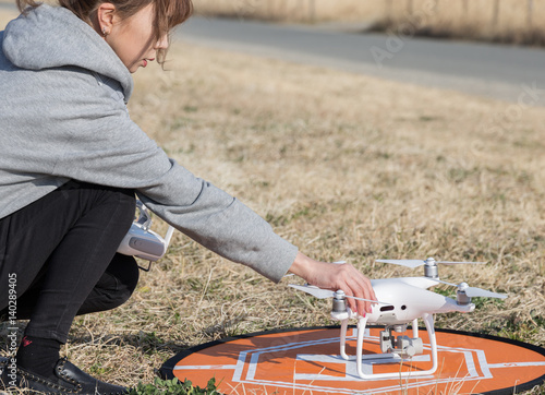woman setting drone in outdoor
